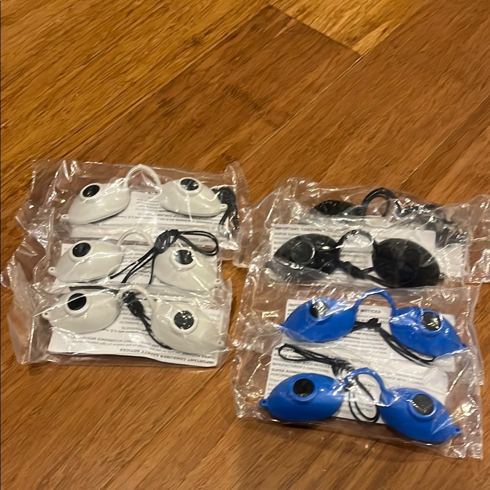 All 7 new in package Assorted Tanning Goggles Set 3 white 2 black 2 blue. Sealed